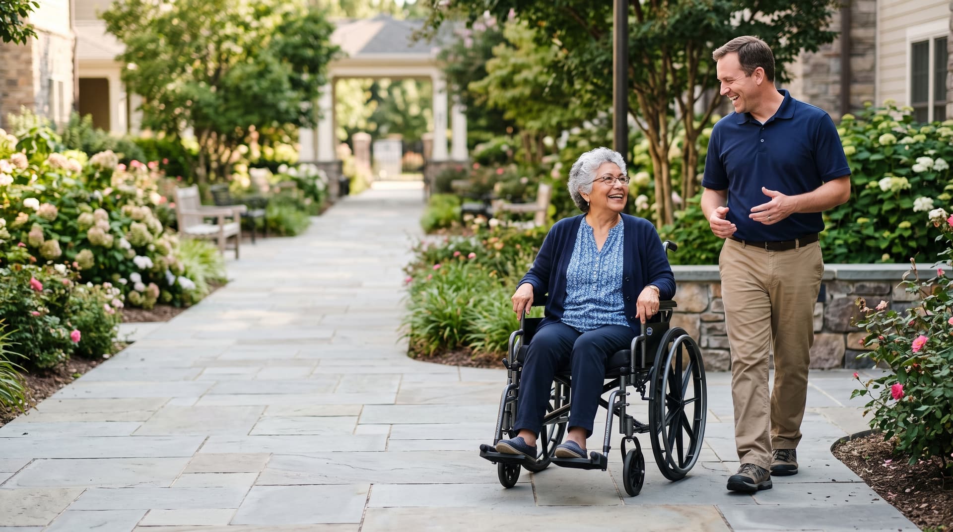 A caregiver assisting a client using a wheelchair with attentive, steady support.